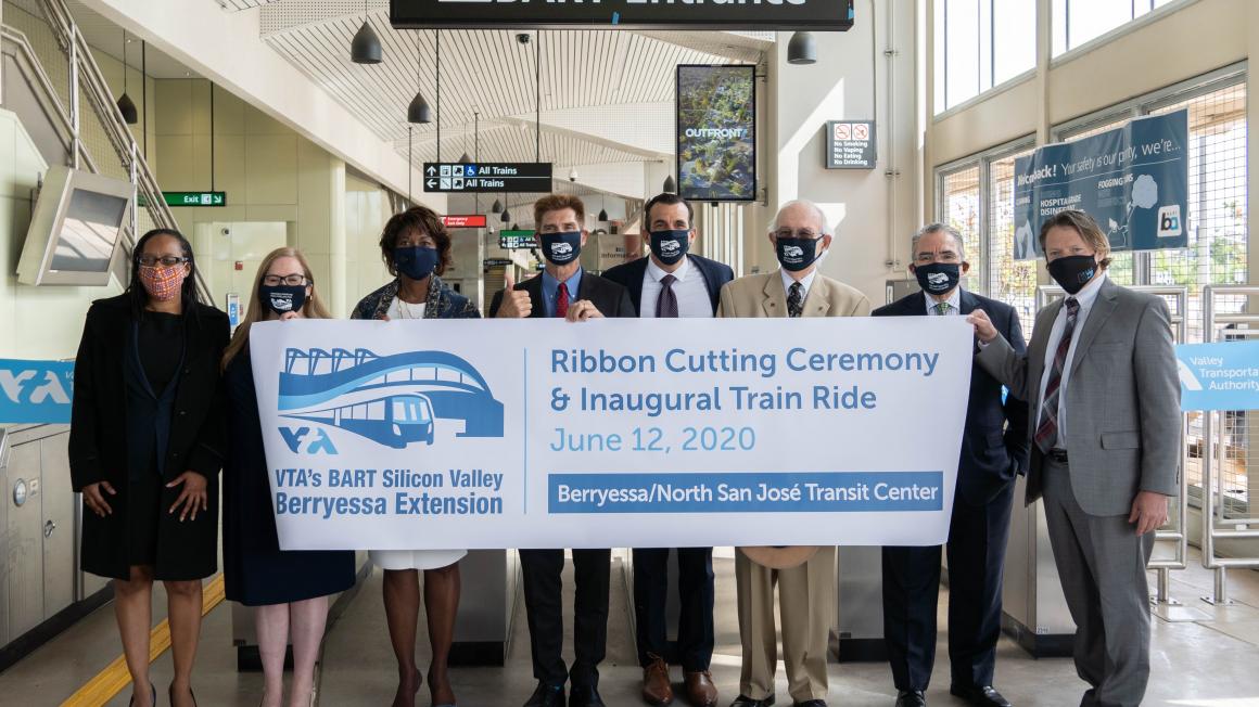 BART and VTA officials hold opening banner