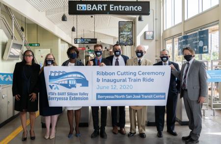 BART and VTA officials hold opening banner
