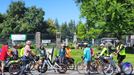 Group of people riding bicycles with VTA staff