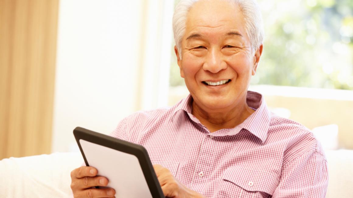 Senior citizen with tablet