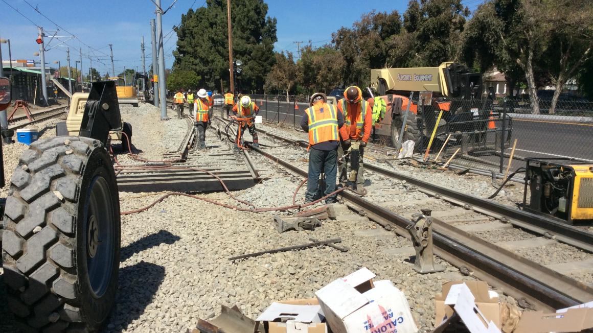 workers on VTA light rail tracks