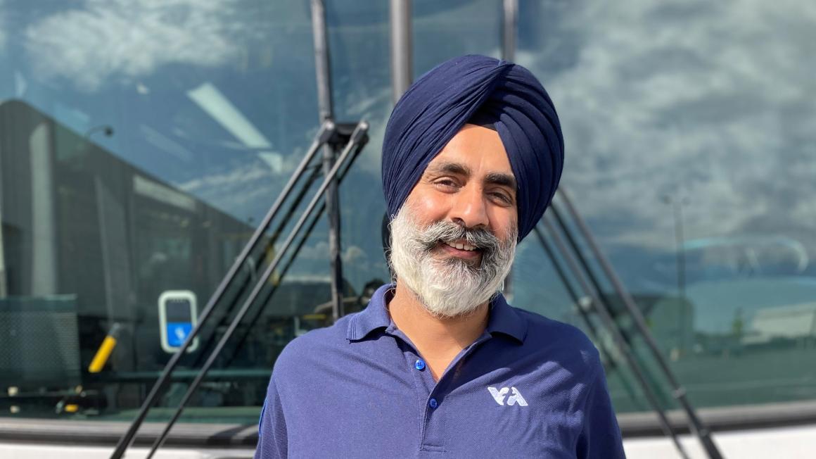 Bus Operator Samarpal Singh poses in front of VTA bus