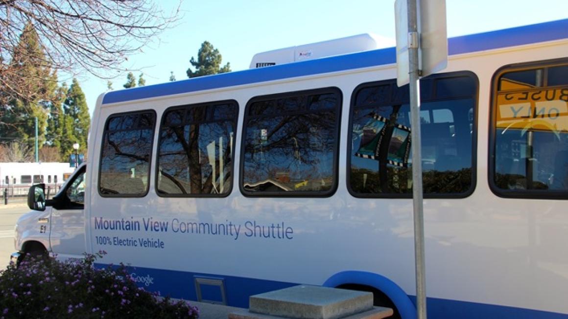 Mountain View Community Shuttle with VTA light rail in background