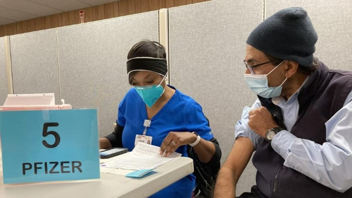 VTA employee receiving a COVID vaccine