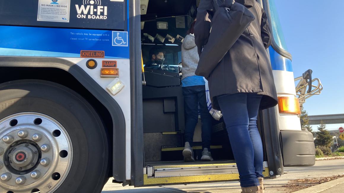 woman boarding bus