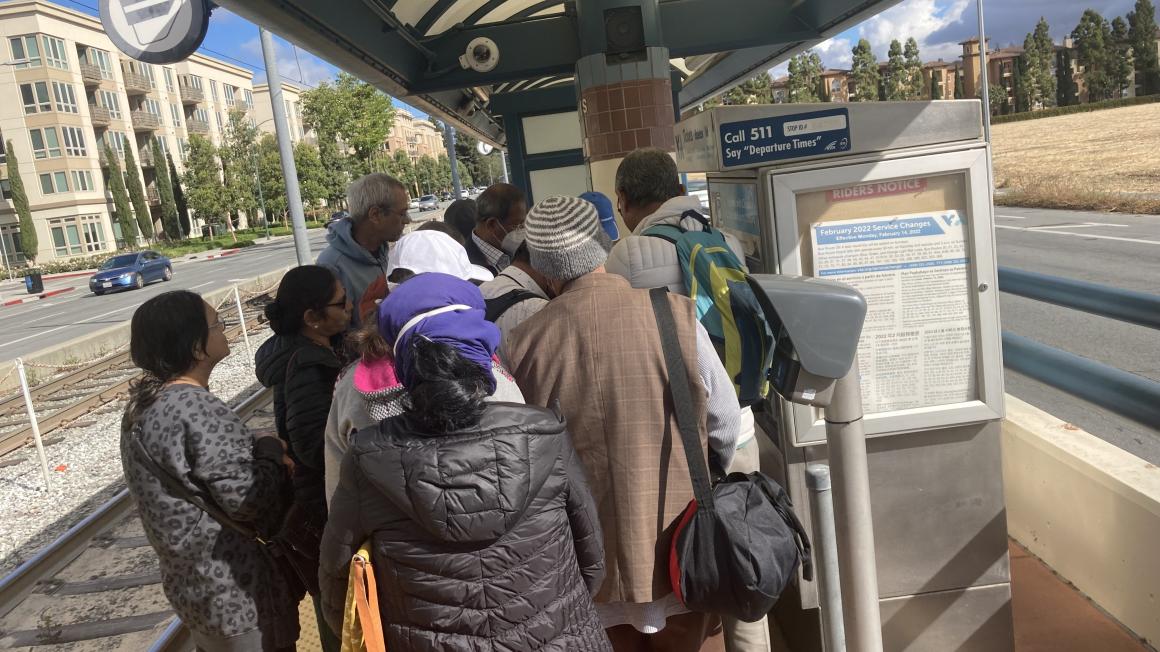 people at vta light rail station