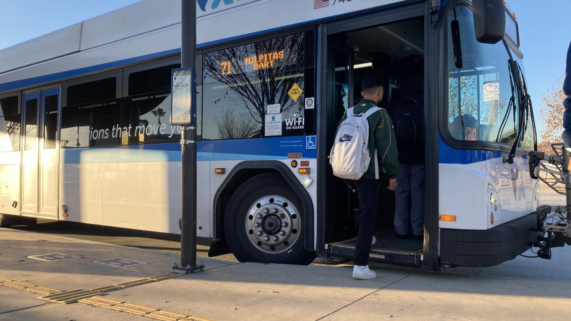 man boarding bus