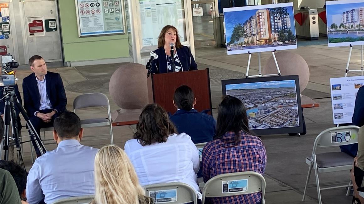 Carolyn Gonot speaking at press conference