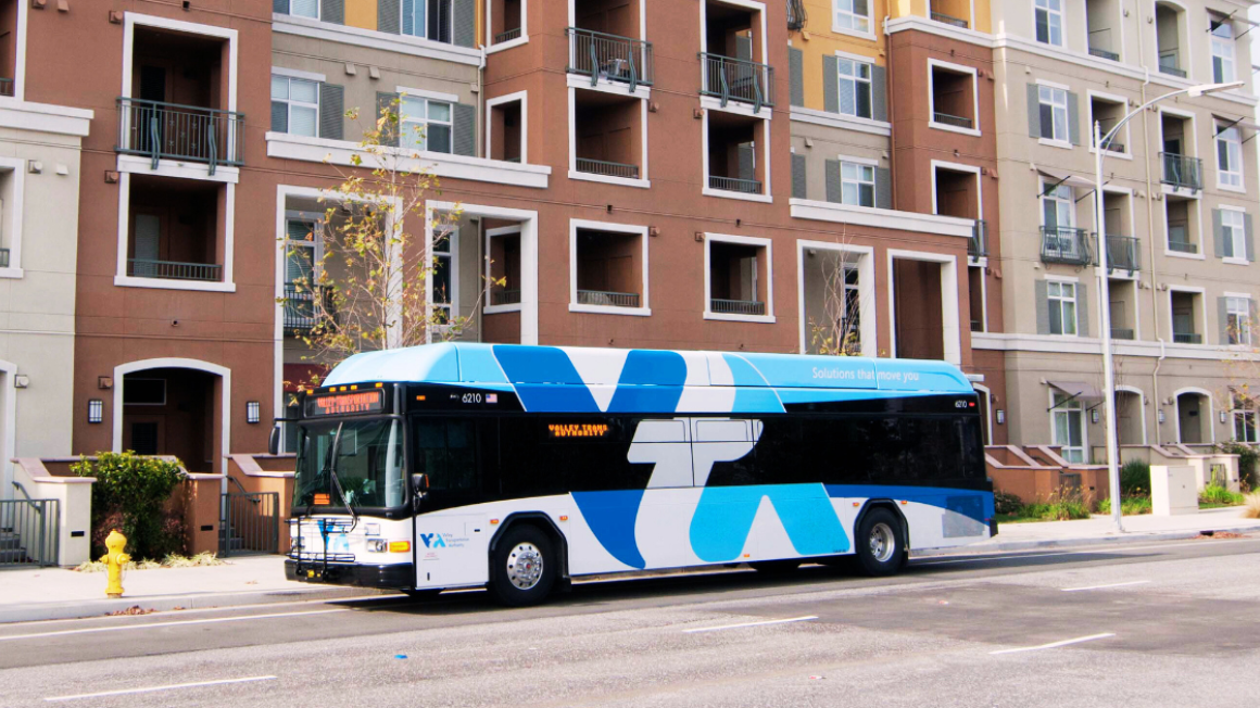 bus in front of apartment building