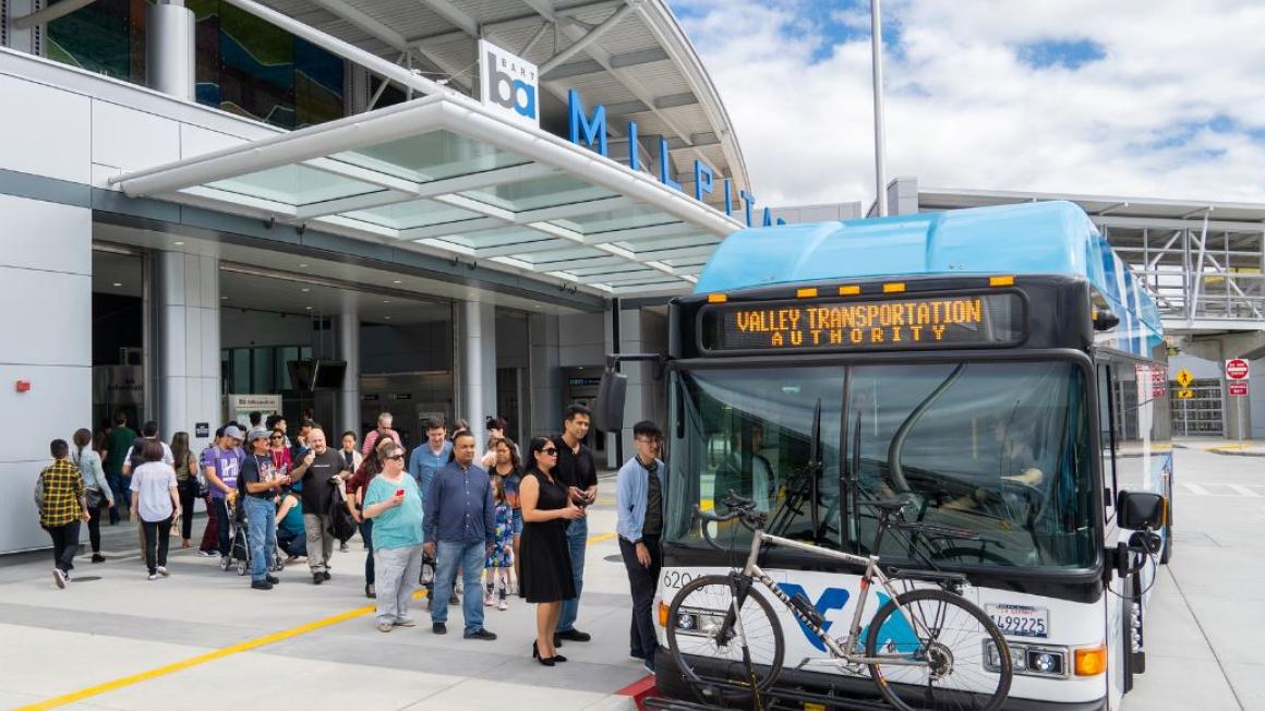 People getting on a VTA bus