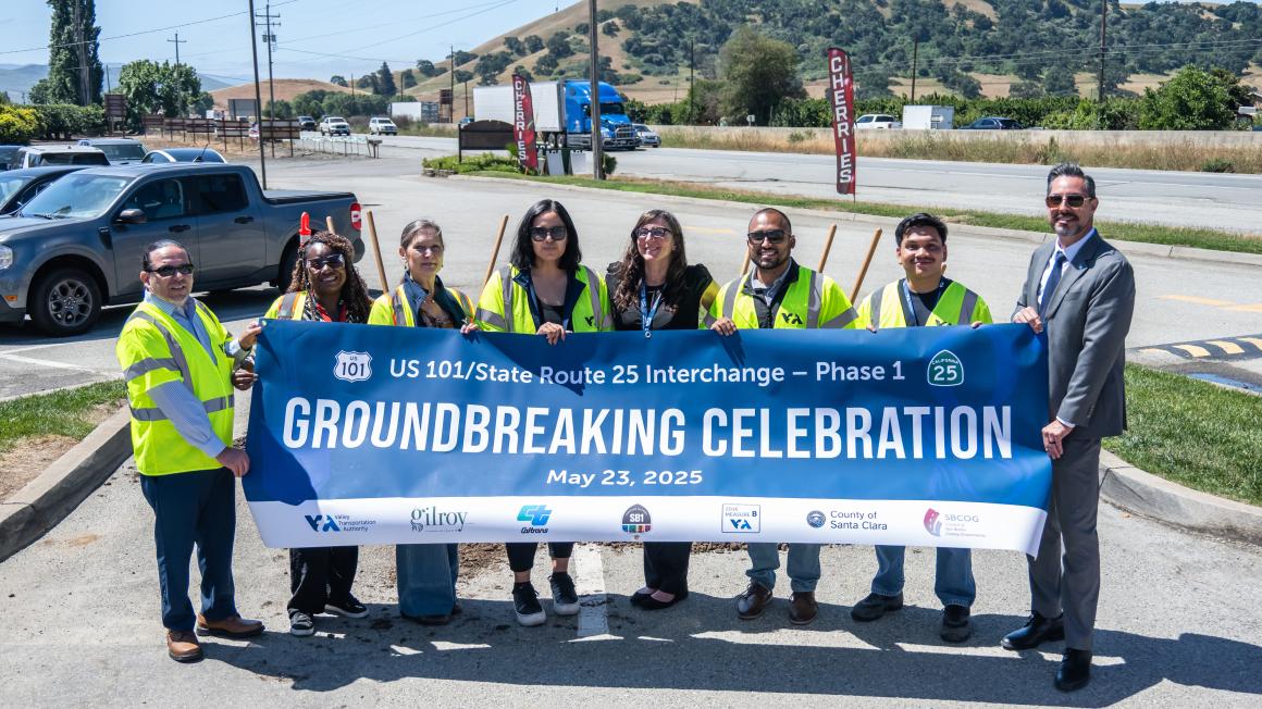 photo of COPE team members with banner