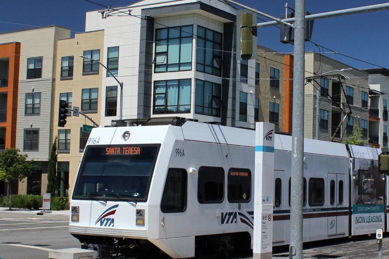 VTA light rail passing a transit oriented development