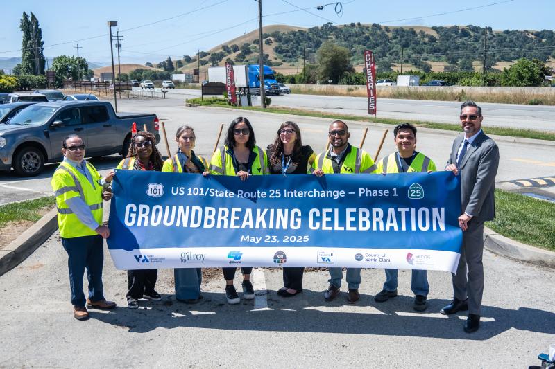 photo of COPE team members with banner