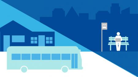 Decorative graphic representing transit oriented development, showing buildings, a bus, and a person waiting at a bus stop