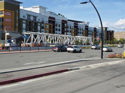 The giant steel truss for the Milpitas Transit Center overcrossing awaits installation