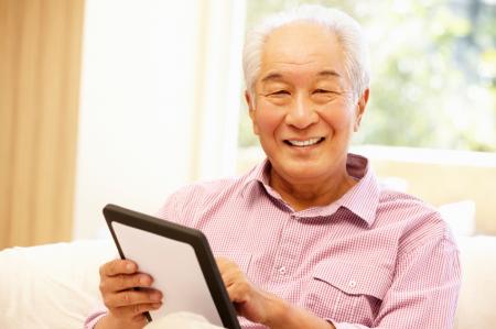 Senior citizen with tablet