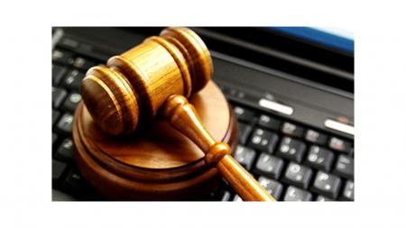 Board Gavel over Computer Keyboard