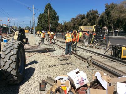 workers on VTA light rail tracks