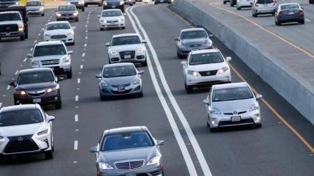 Cars drive on highway express lanes