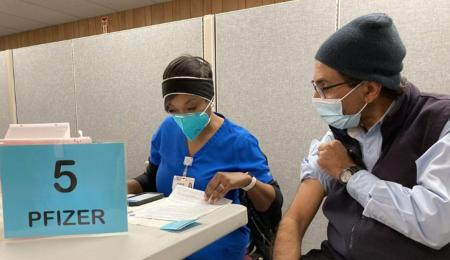 VTA employee receiving a COVID vaccine