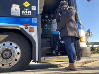 woman boarding bus