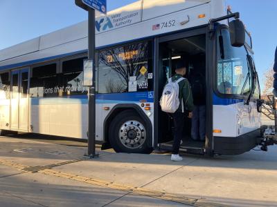 man boarding bus