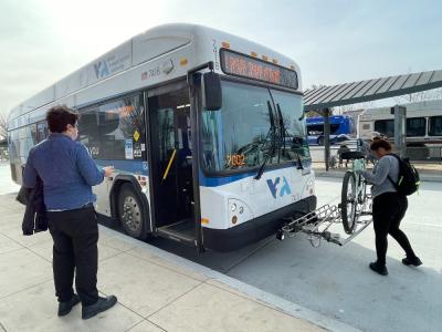 bus passenger and bicyclist