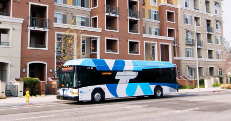 bus in front of apartment building