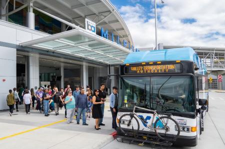 People getting on a VTA bus