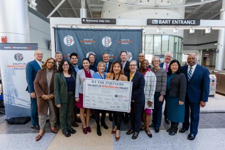 group shot of transit agency CEOs with pledge board