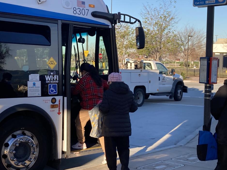 passengers boarding bus