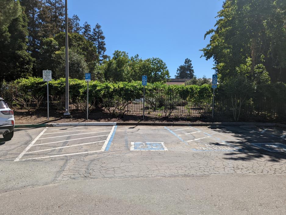 A photo of two accessible parking spaces.