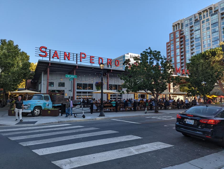 A photo of a filled patio seating at San Pedro Market.