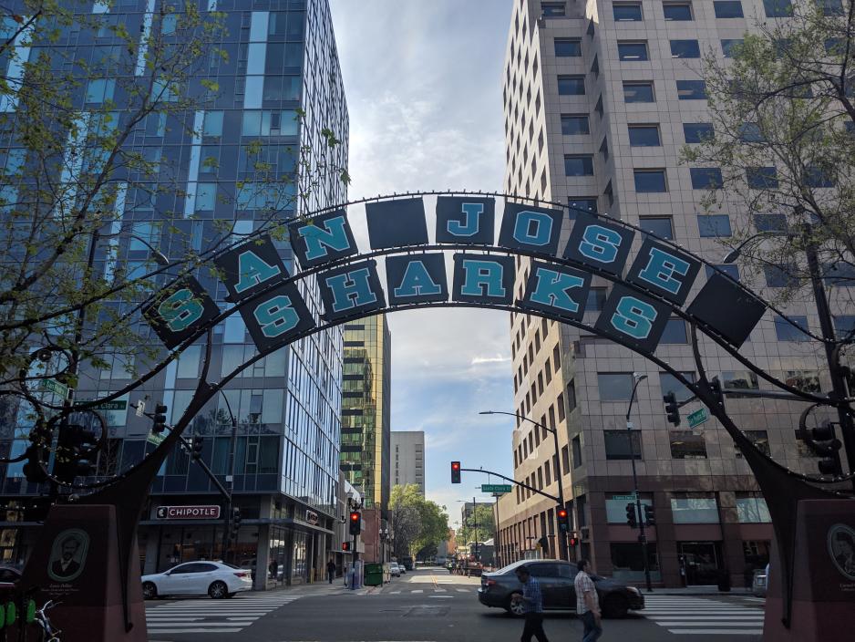 A photo of an archway with the words "San Jose Sharks" in downtown San Jose.