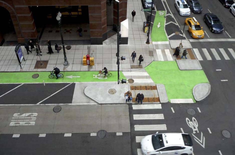 Aerial photo showing intersection of separated bikeway and sidewalk.