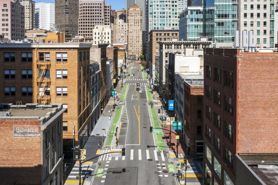 Aerial photo of a city street showing high visibility crosswalks crossing at regular intervals.