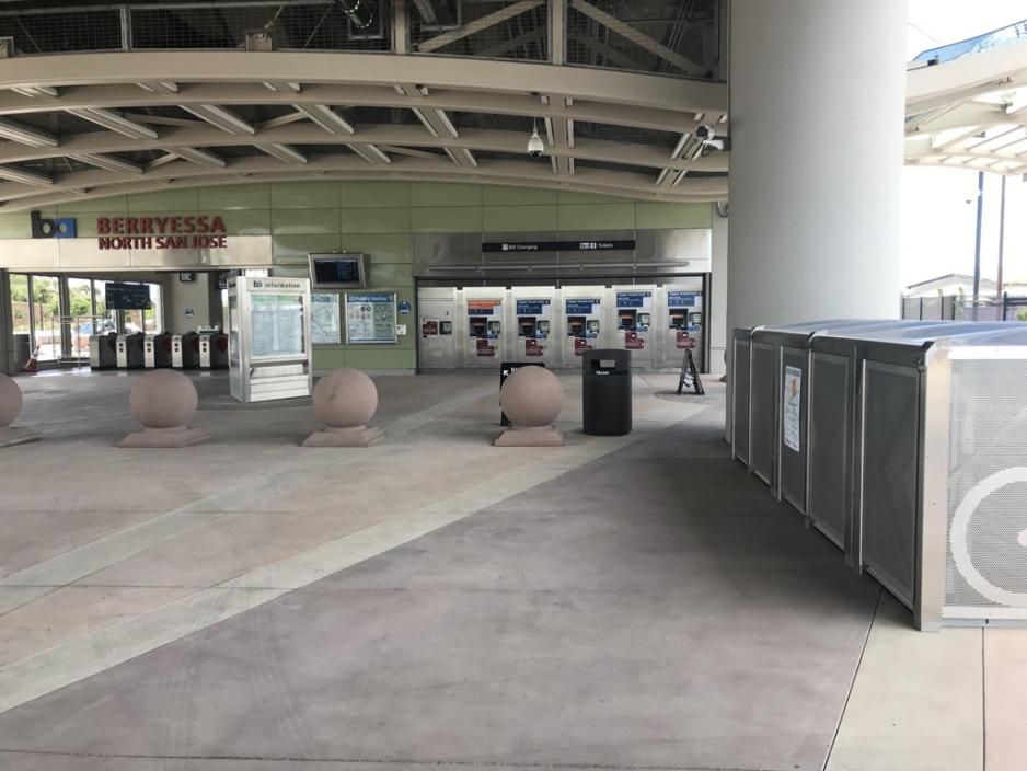 Photo of the entrance to the Berryessa BART station with ticket machines and bike lockers