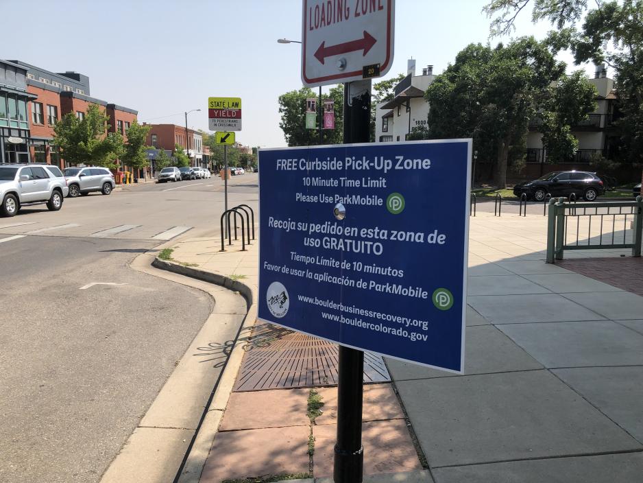 Photo of sign explaining free 10 minute parking allowed 