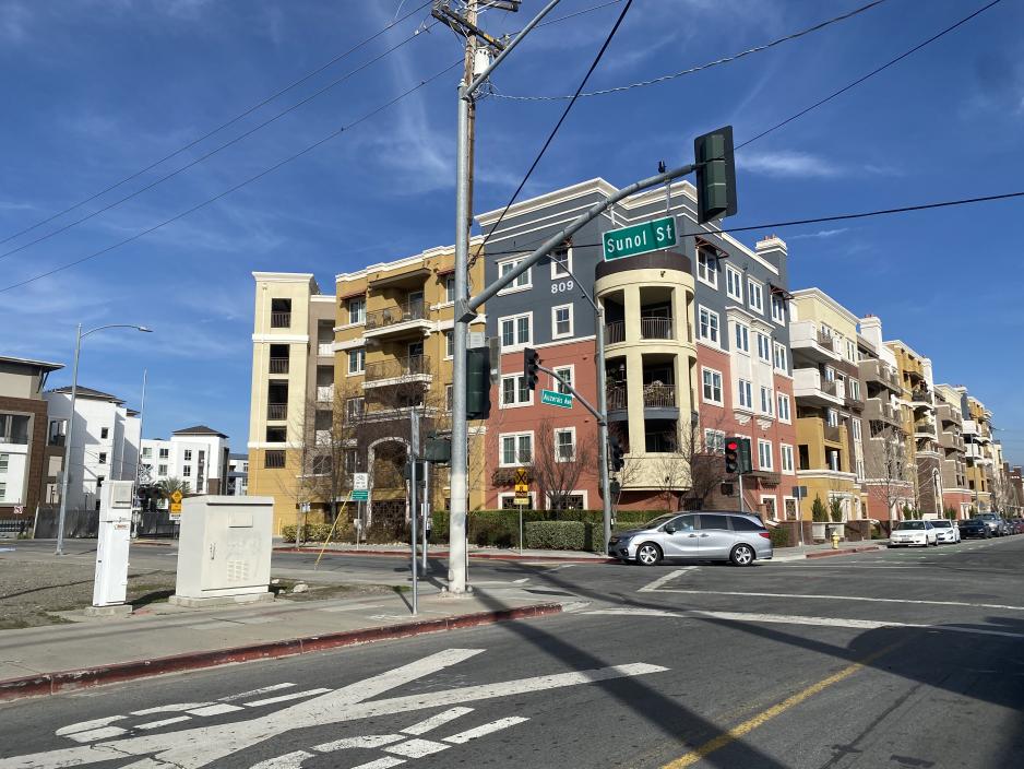 A photo of five store apartment complex in downtown San Jose.