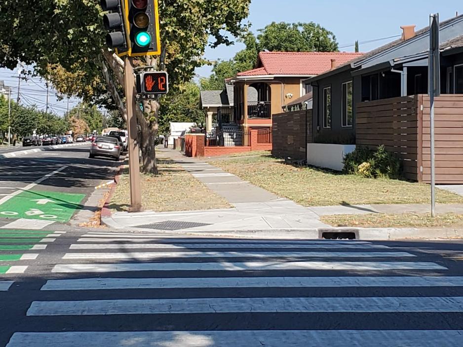 Photo of a pedestrian crossing with a countdown signal showing the amount of time left to cross.