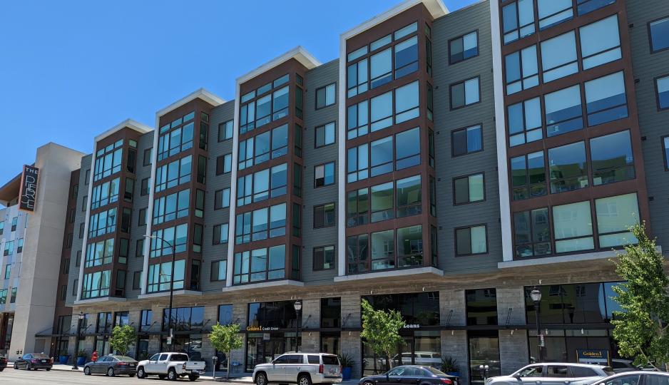 Photo of a taller brown and blue building