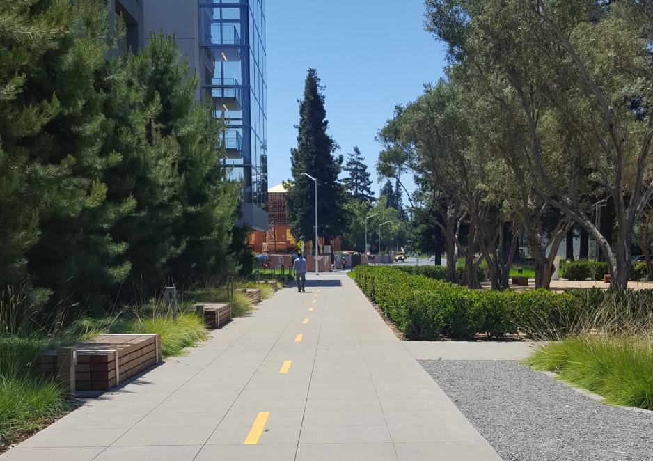 Photo of a trail connection passing through a business park.