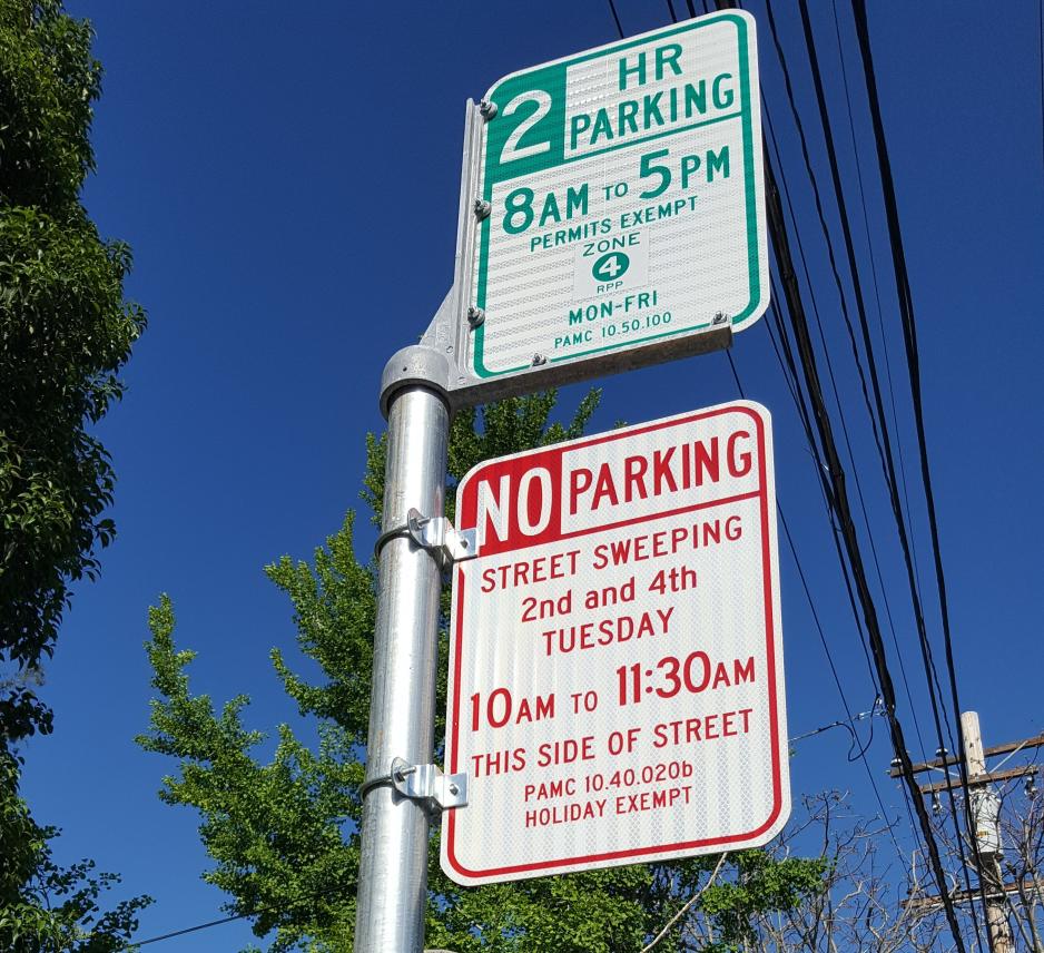 A photo of an on-street 2-hour parking sign.