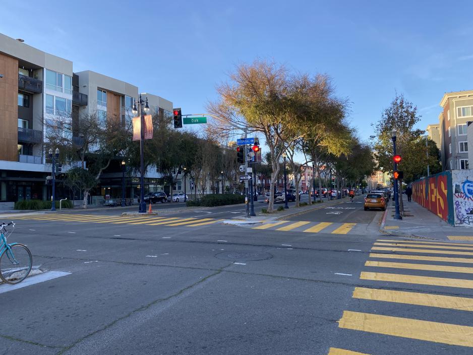 A photo of a street with crosswalks and bikes.