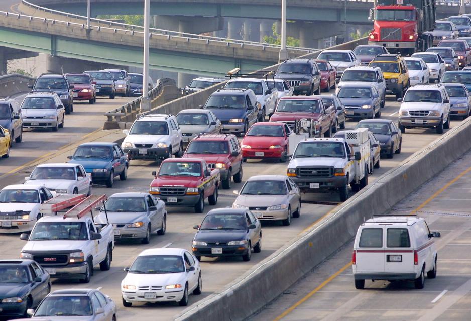 Photo of a congested freeway with several vehicle lanes