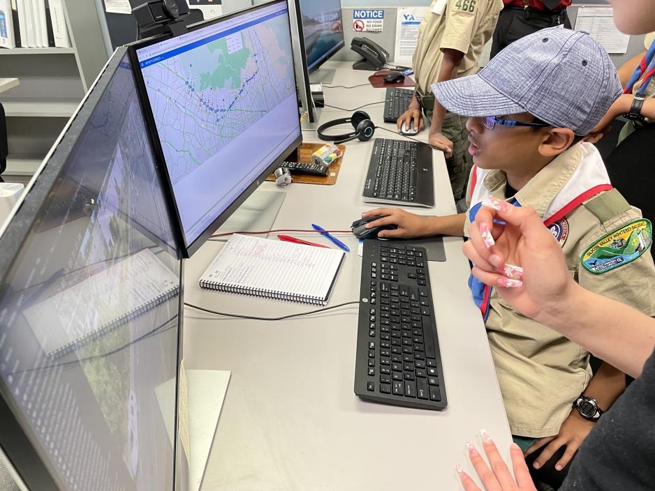 Boy Scout on computer learning about express lanes