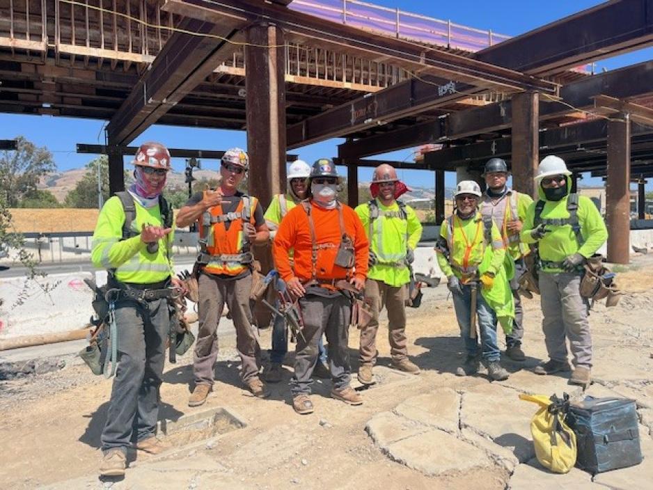A crew of carpenters and laborers