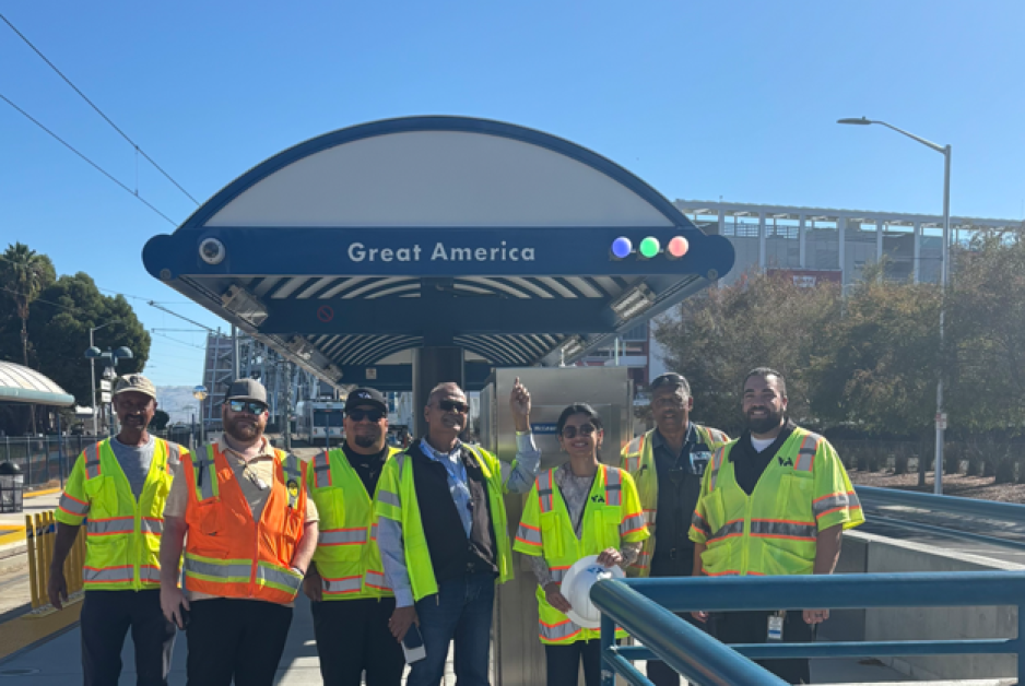 VTA staff in vests posing for a group photo at the Great America light rail station